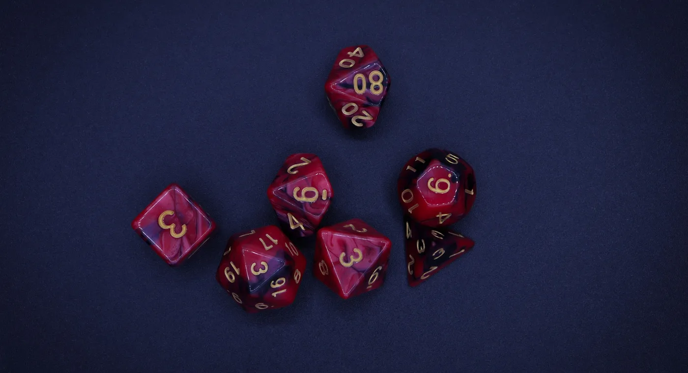 A seven-dice polyhedral set in swirled red and purple, laid out on dark blue felt